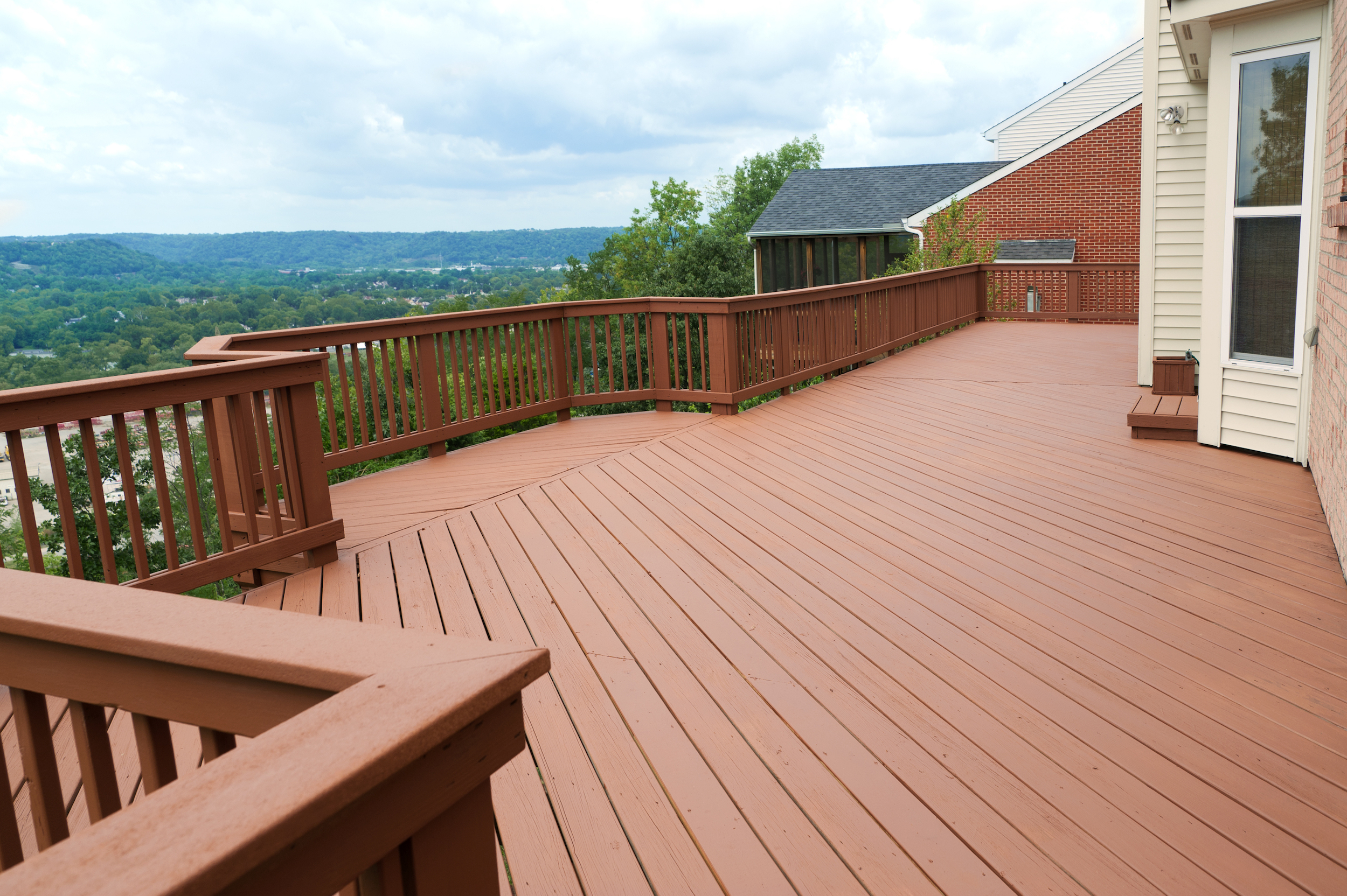 A,Freshly,Painted,And,Stained,Wood,Deck,With,Railing,On