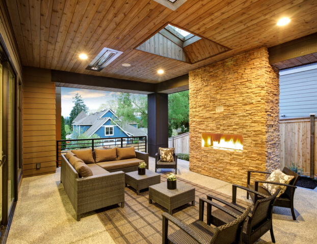 Dreamy,Outdoor,Covered,Patio,With,Stone,Fireplace,,A,Beadboard,Ceiling