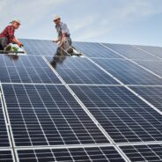 Low,Angle,Of,Two,Men,Solar,Technicians,Building,Photovoltaic,Solar